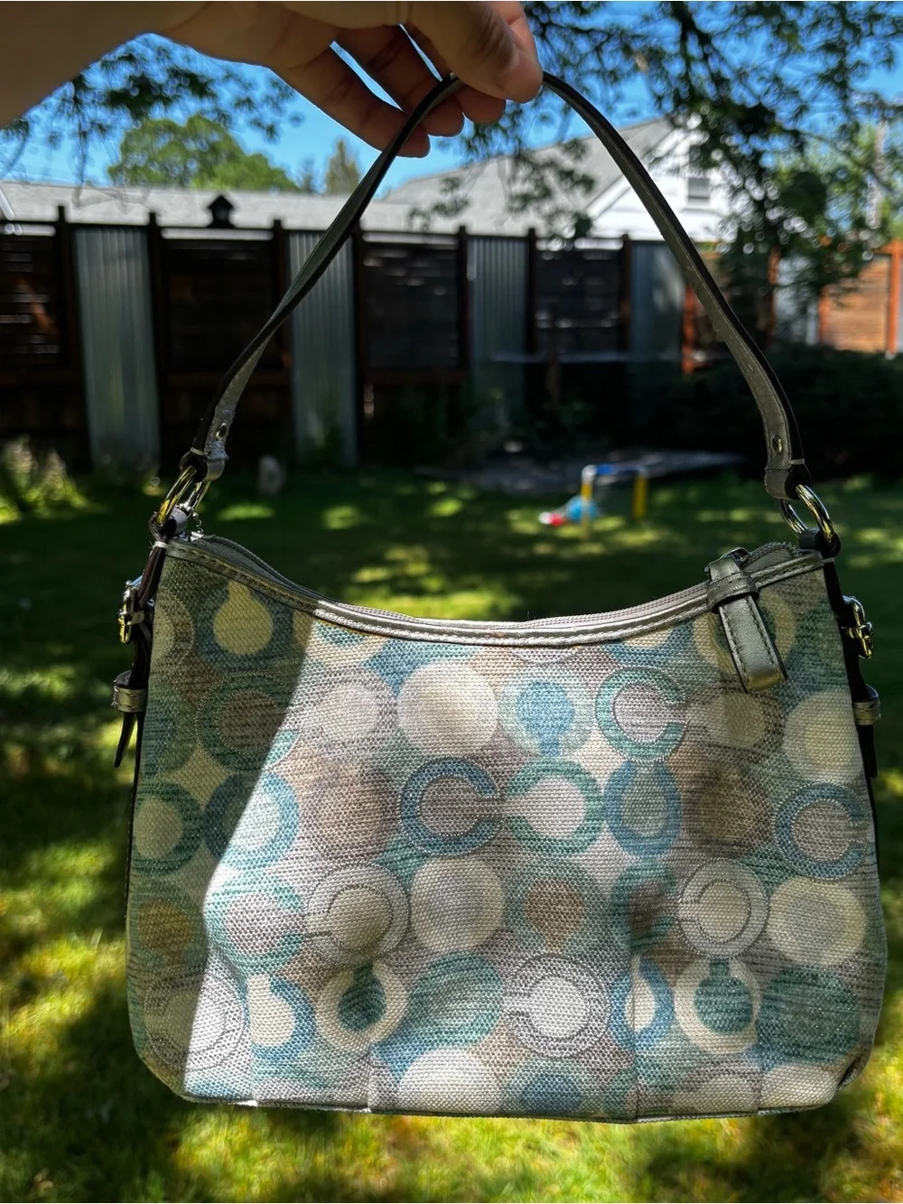 Coach baguette shoulder bag featuring a multicolored 